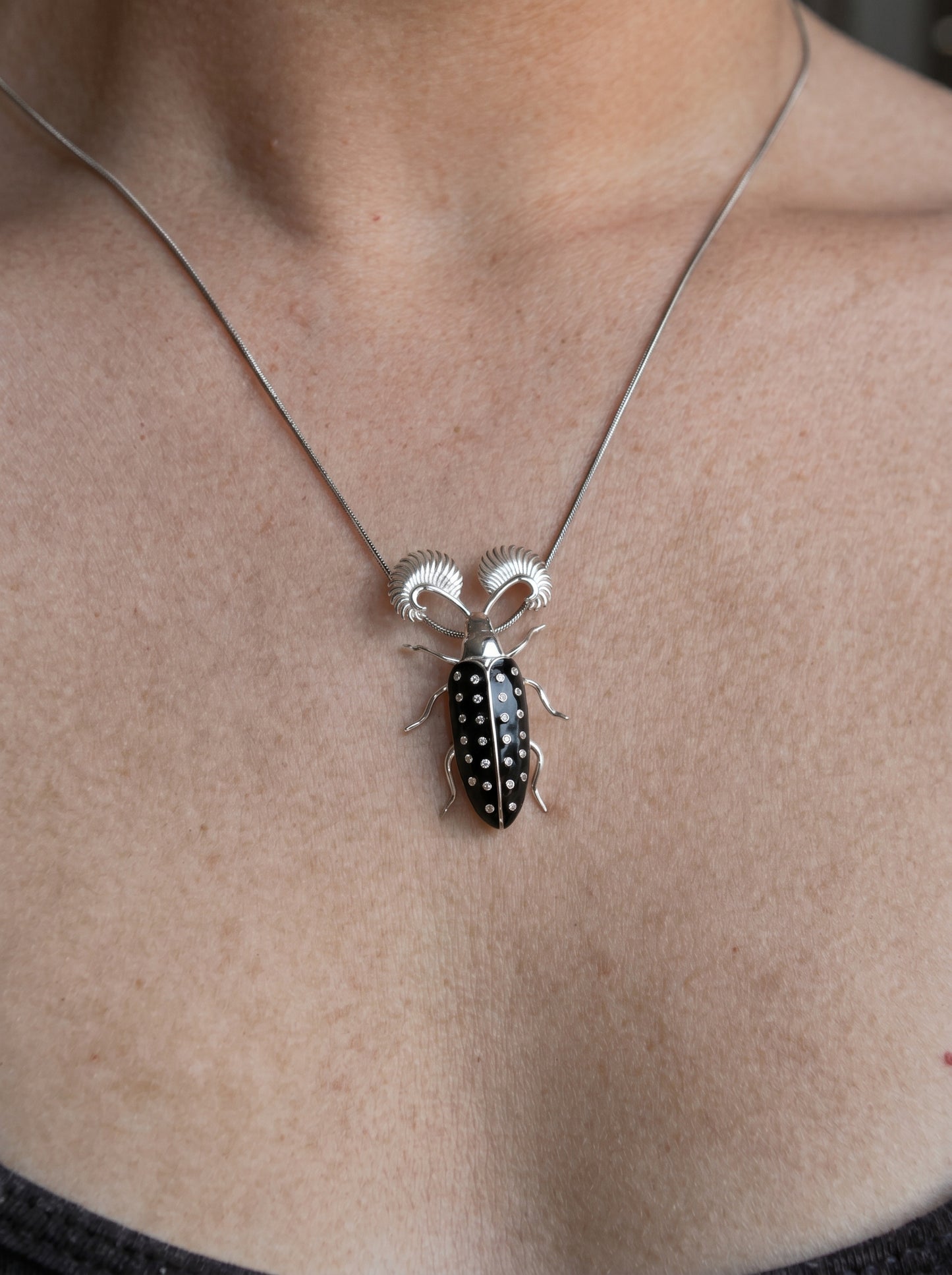 Feather‑Horned Beetle Pendant — Rhipicera sp. • Black Enamel + Crystals