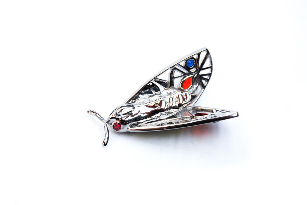 Back view of Picasso Moth pendant in sterling silver with rhodium finish on white background