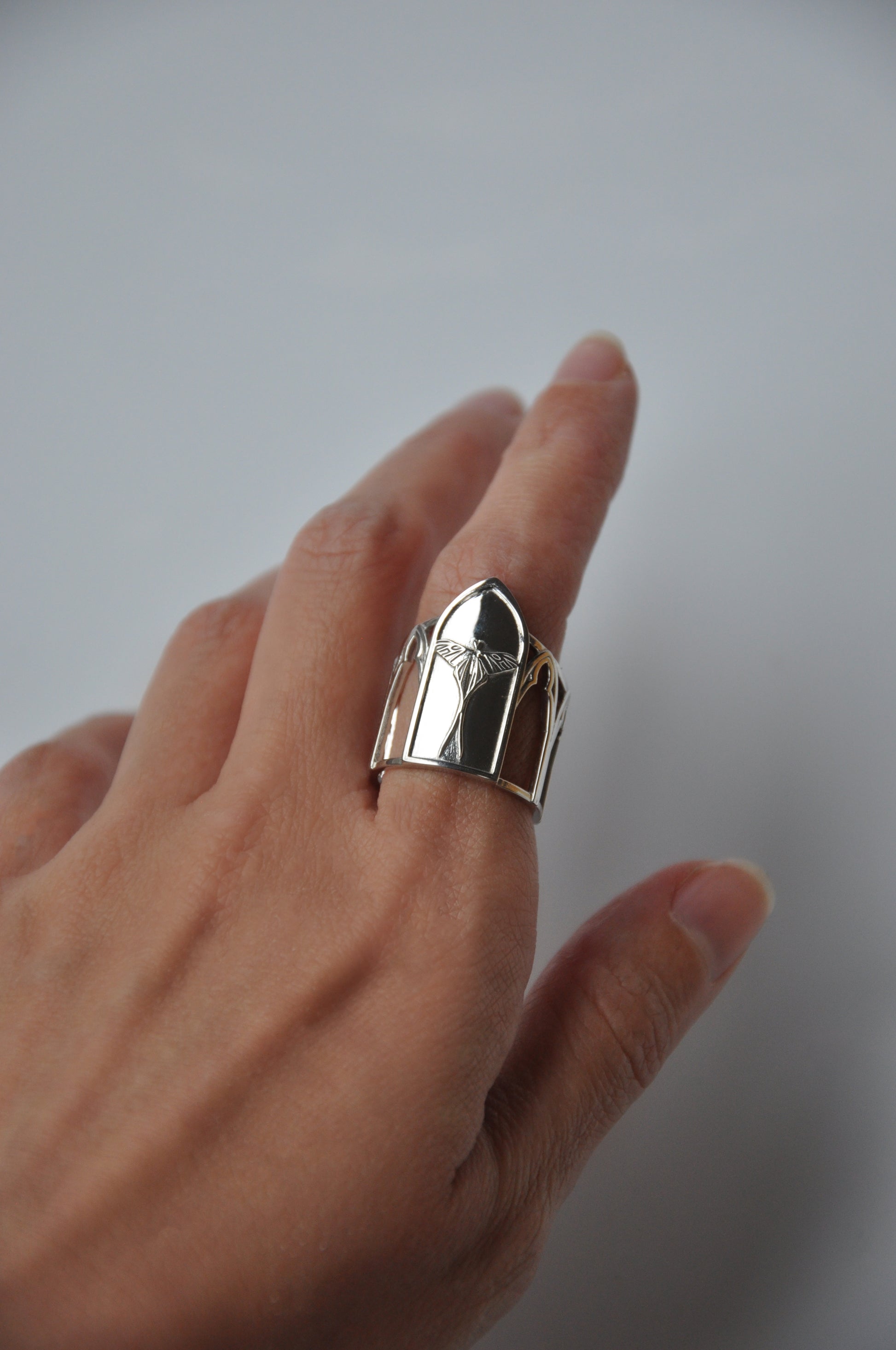 Side view of Sanctuary of Wings ring – silver Luna moth design with gothic arches and cathedral-inspired details by Anna Reikher