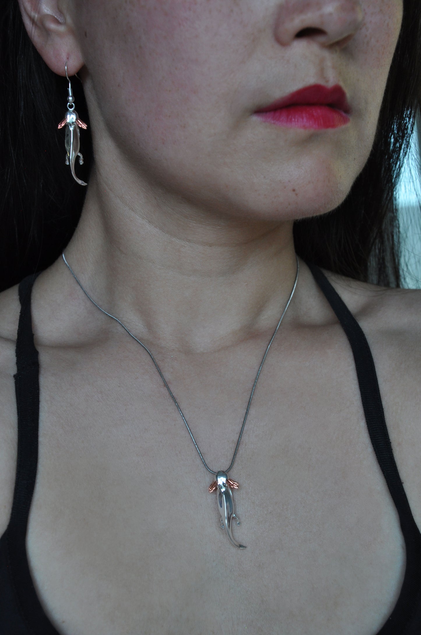 Model wearing the Axolotl Drop Earrings and matching pendant, styled to showcase the playful elegance and mixed-metal design of the jewelry set.