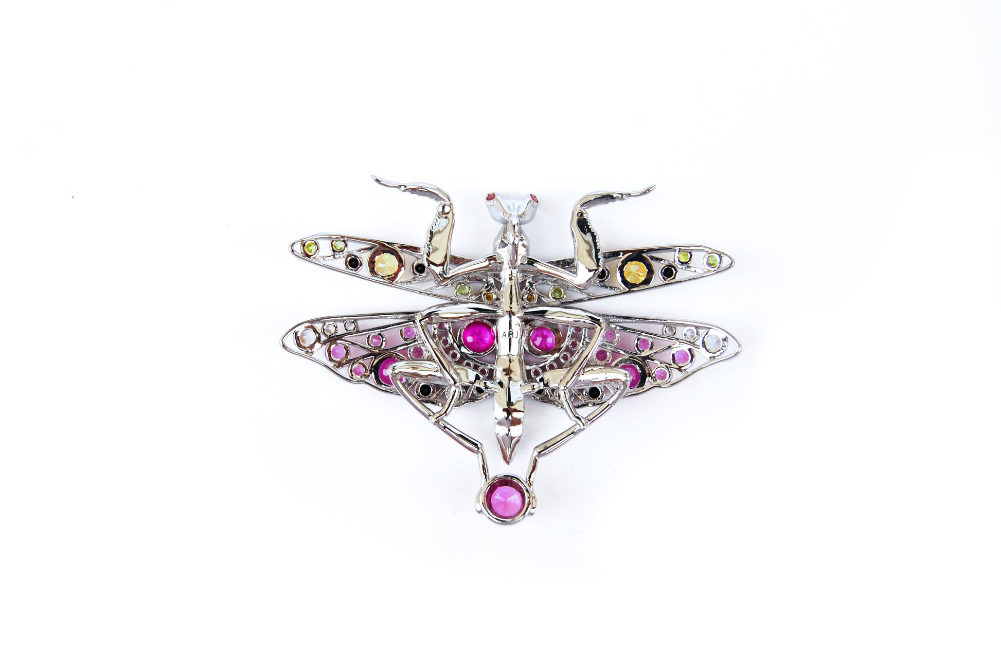 Back view of silver praying mantis pendant on white background showing clasp and sculpted body details