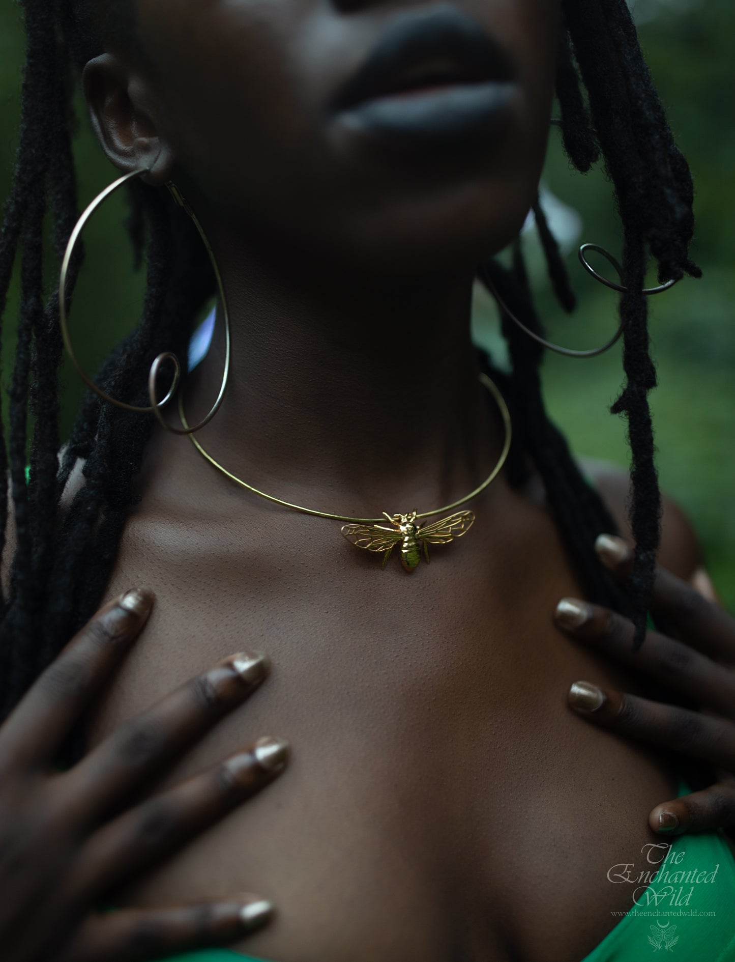Model wearing gold bee pendant necklace, front view