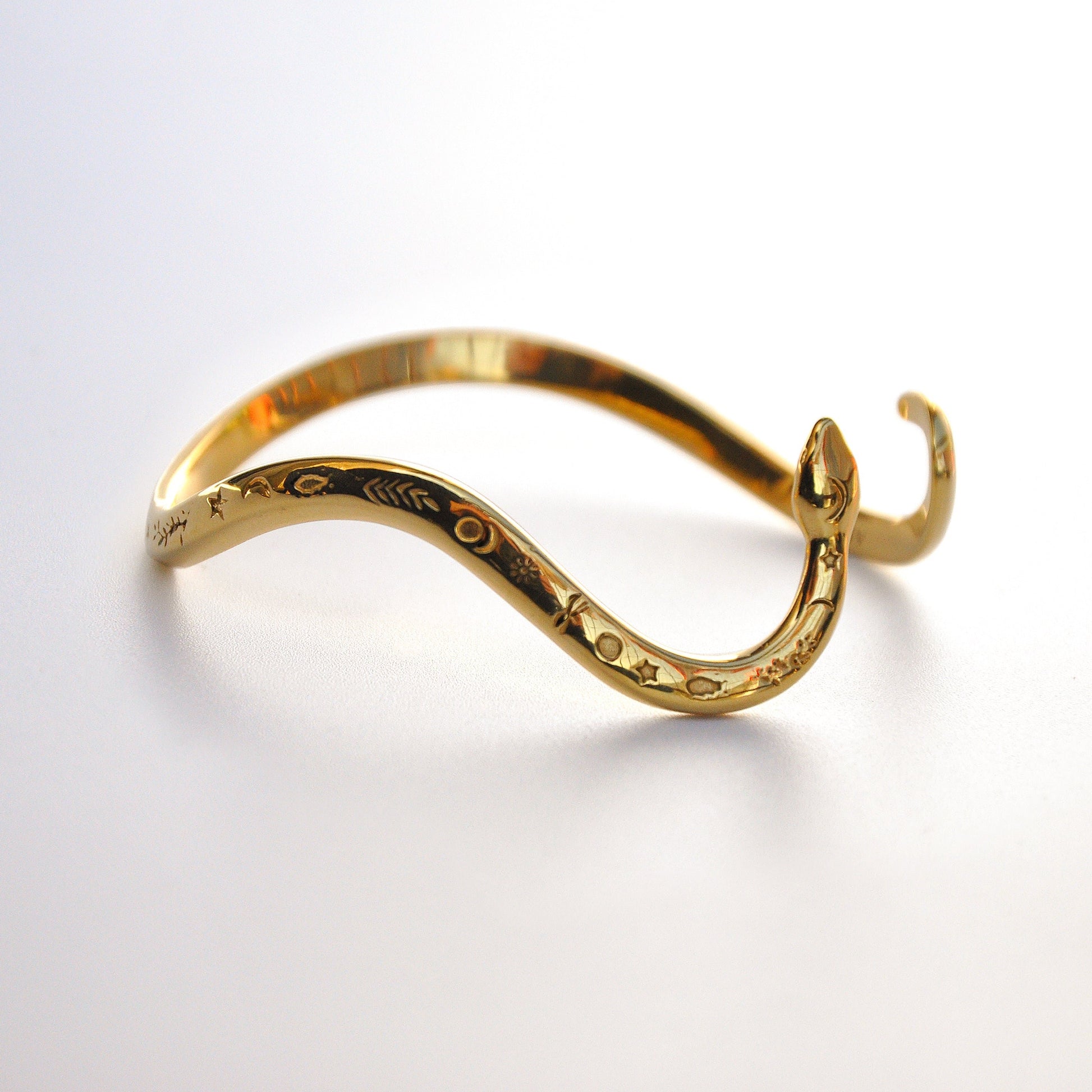 Celestial snake bracelet in 14k gold‑plated finish, photographed on a white background, designed in Italy.