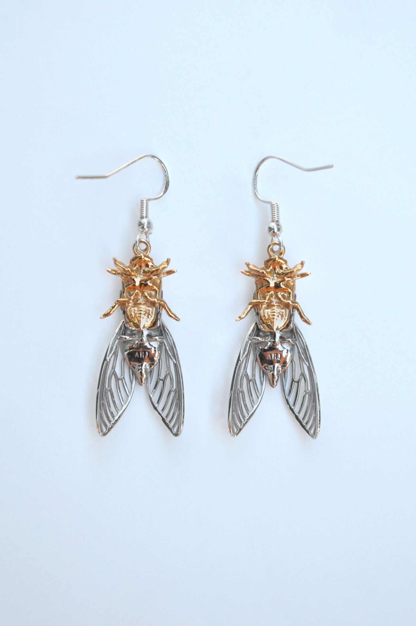 Unique cicada insect and shell drop earrings, handcrafted with intricate details