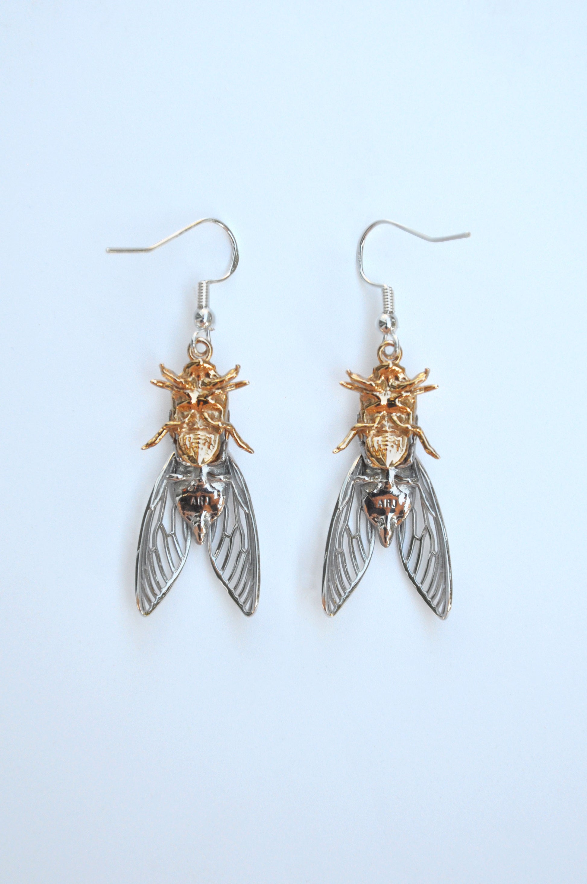 Unique cicada insect and shell drop earrings, handcrafted with intricate details