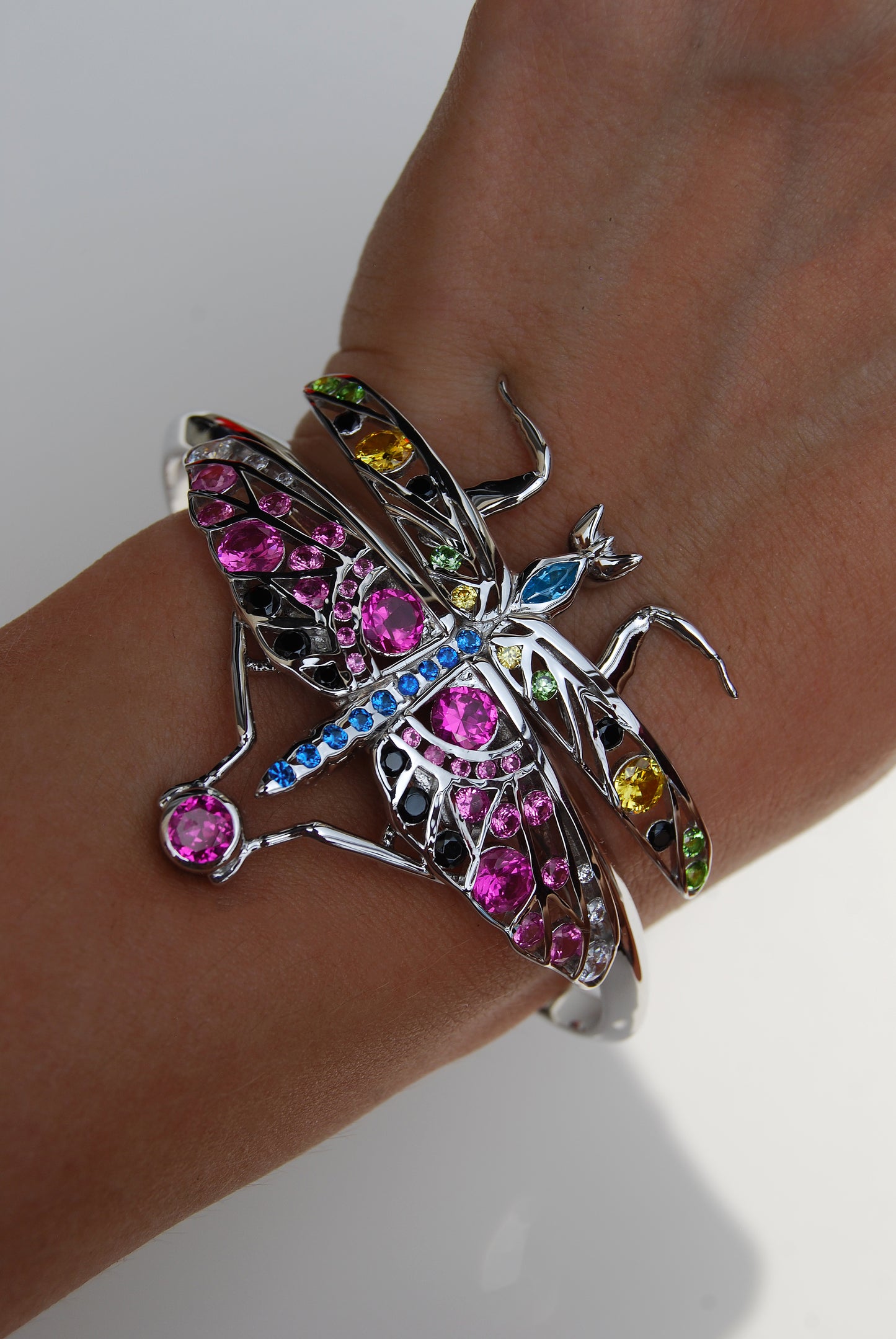 Close-up of sterling silver praying mantis bracelet with enamel and zirconia details highlighting intricate craftsmanship