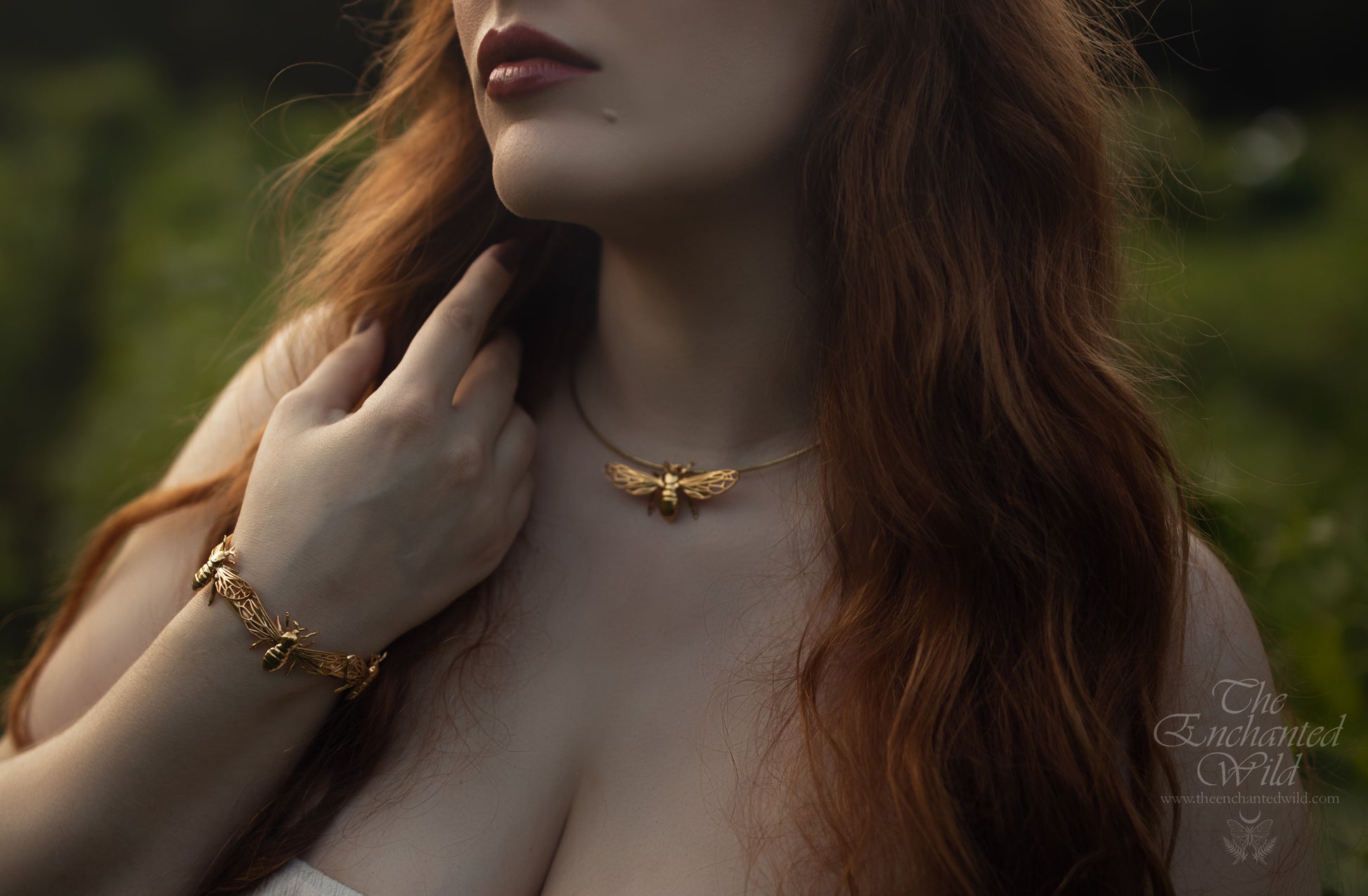 Front view of model wearing gold bee charm necklace 
