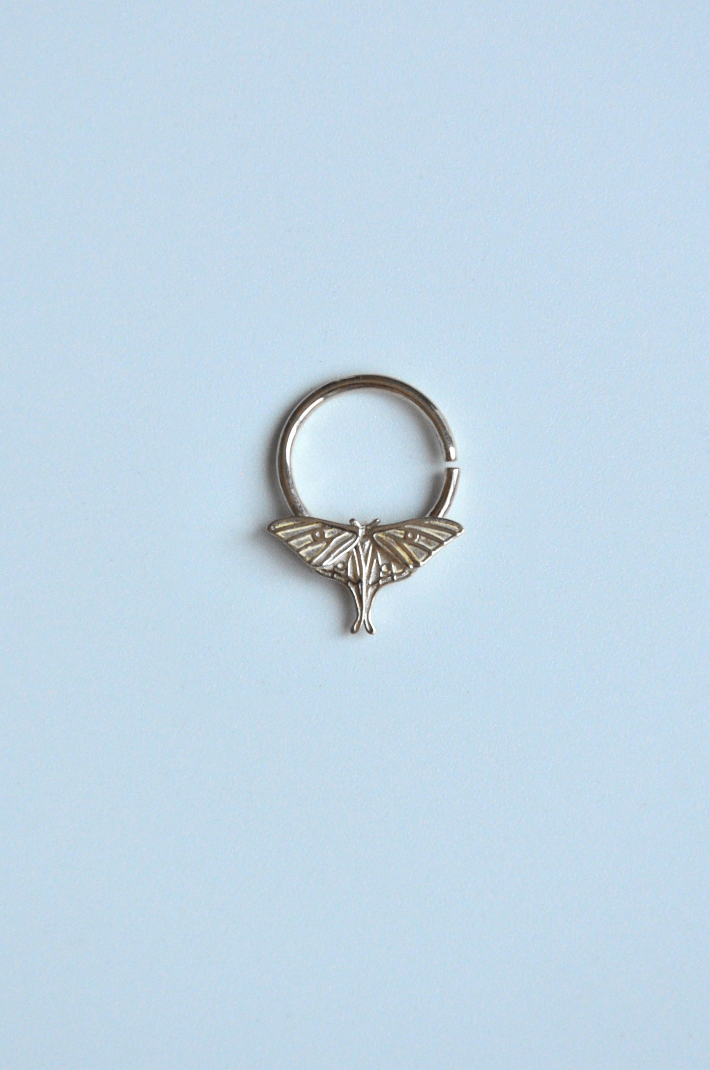 Sterling silver luna moth septum ring, delicate insect jewelry inspired by nature, perfect for unique statement piercing