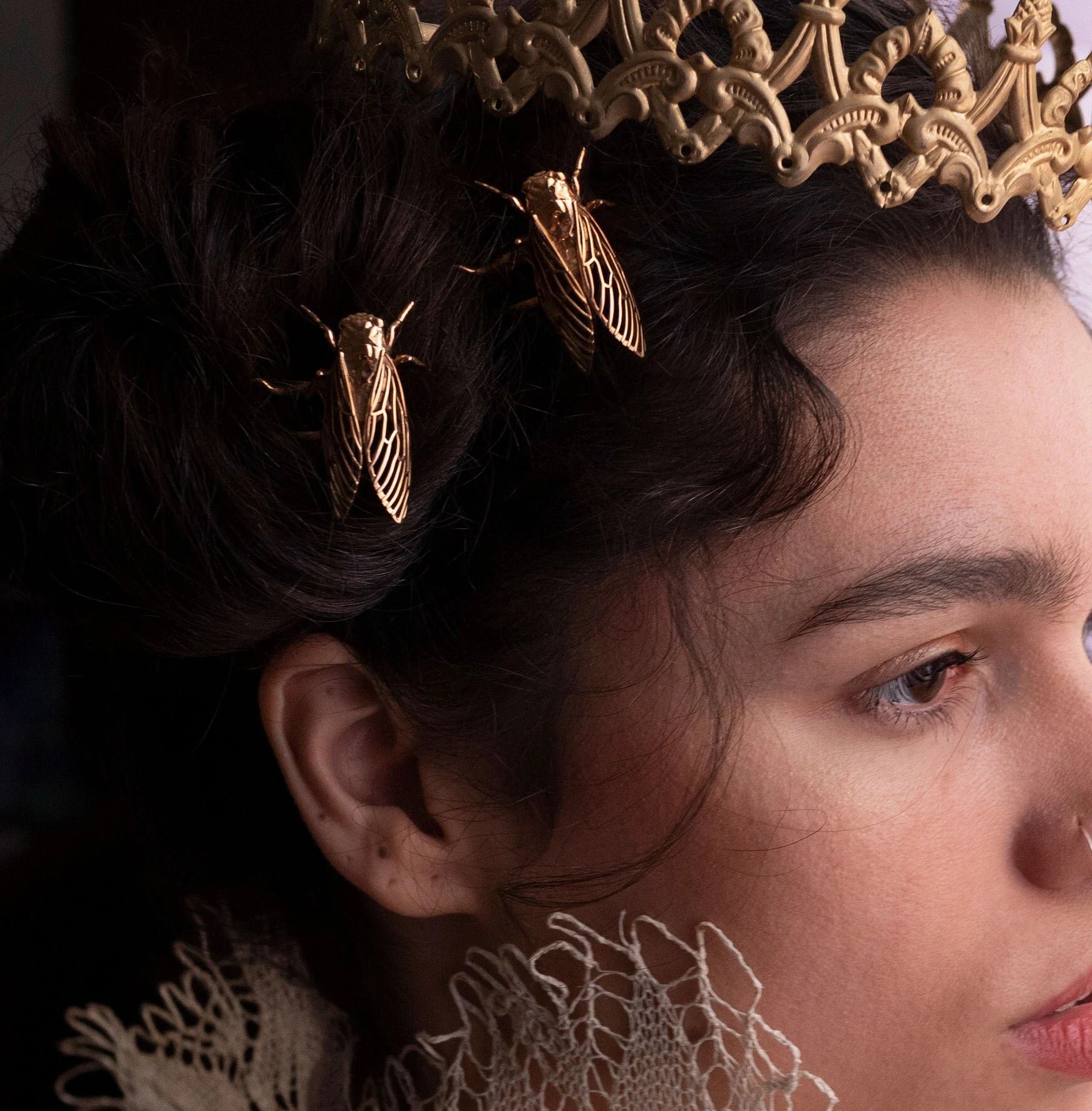 Model wearing bronze Cicada hair pins styled in a nature-inspired look, showcasing handcrafted insect jewelry with detailed wing cutouts and vintage bronze finish.