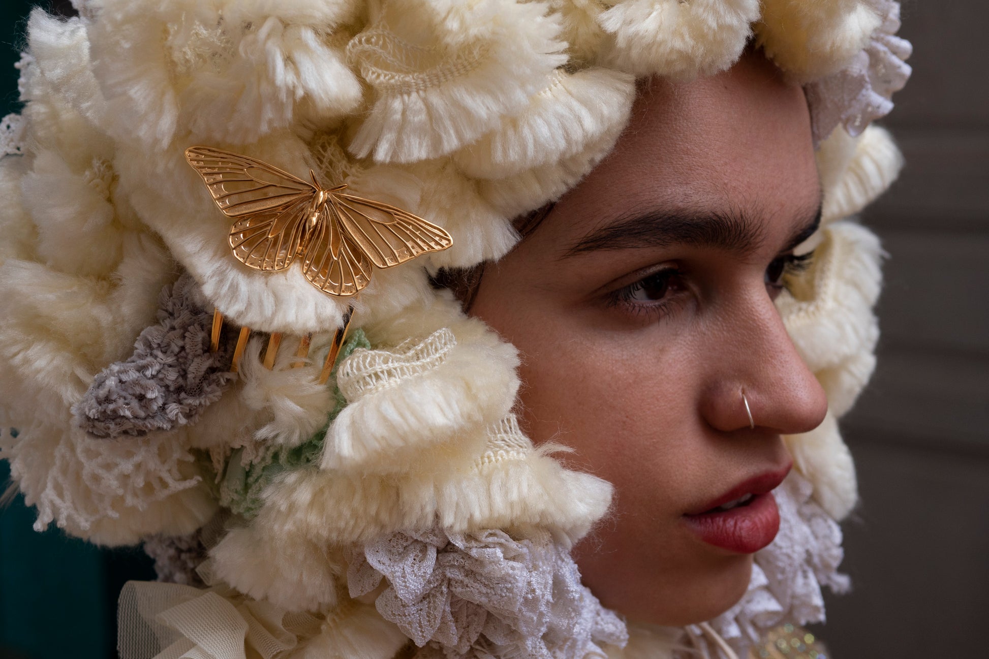 Model wearing a 14k gold plated Monarch Butterfly hair comb, styled in an ethereal fantasy costume setting. The comb’s luminous wings glint against flowing fabrics and enchanted lighting, evoking a regal, woodland-inspired aesthetic.