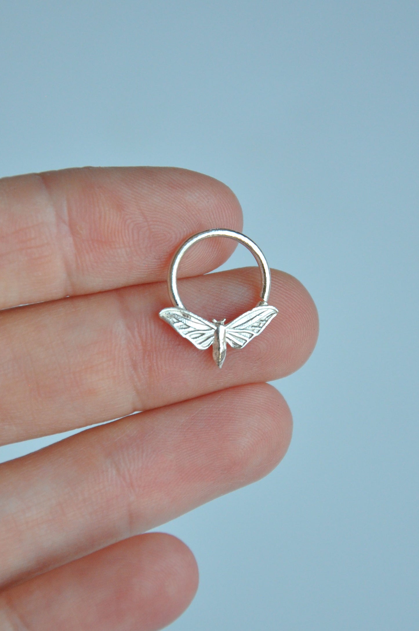Nature-inspired hawk moth septum ring in sterling silver, ideal for insect jewelry collectors