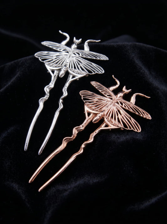 Silver and rose gold Orchid Mantis hairpins resting on black velvet, sculptural and surreal with delicate sharp lines.