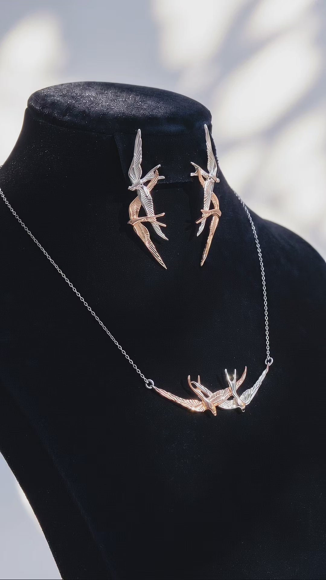 Video preview showing Swallow Flight Stud Earrings paired with matching necklace, capturing polished surfaces and sculptural symmetry.
