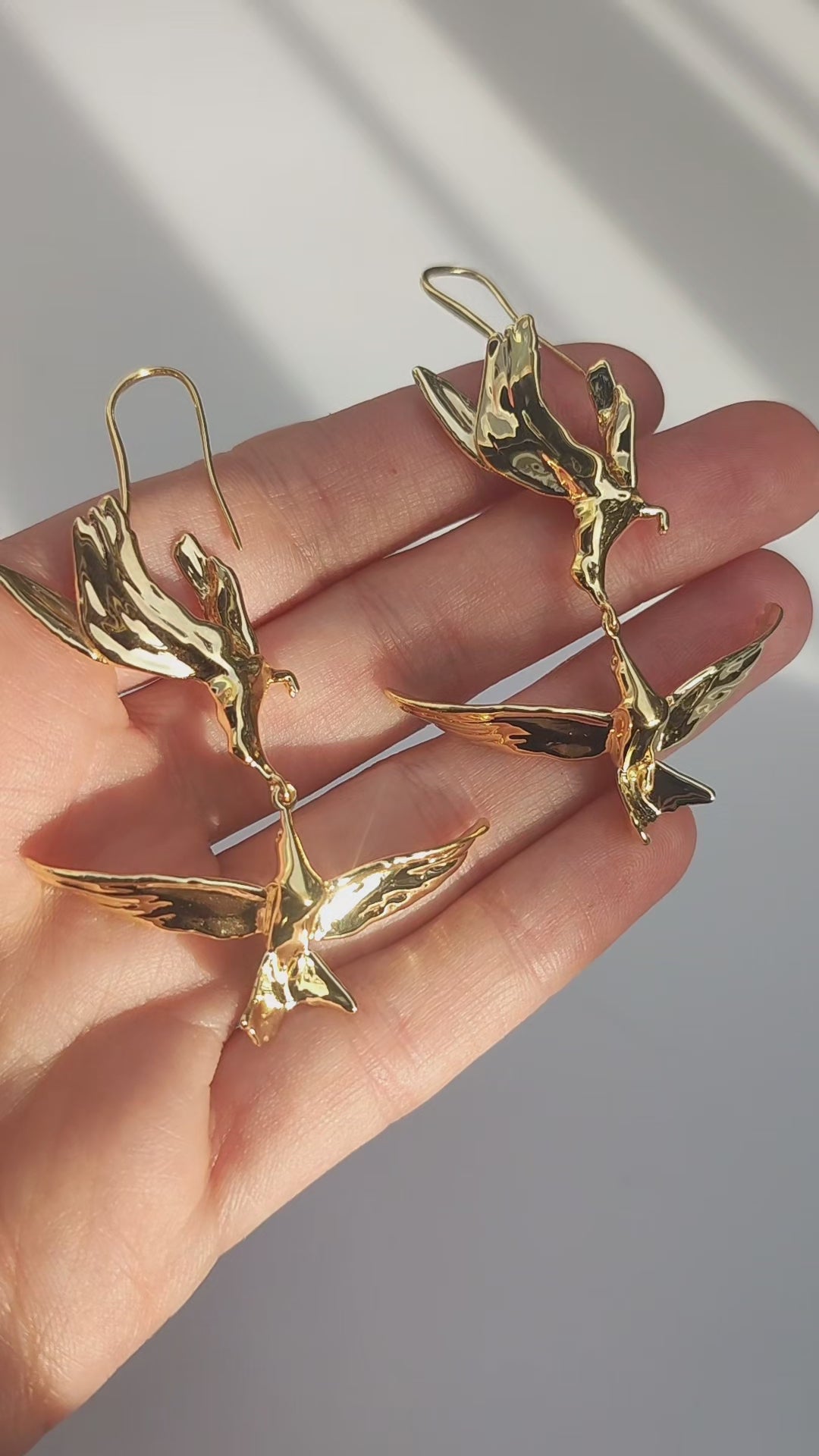 Video preview showing Kiss in Flight Arctic Tern Earrings and inspiration, capturing polished surfaces and delicate bird contours.