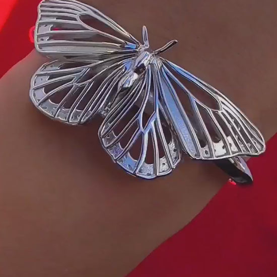 Video of silver Monarch Butterfly Bracelet on hand, highlighting movement, craftsmanship, and sculptural detail.