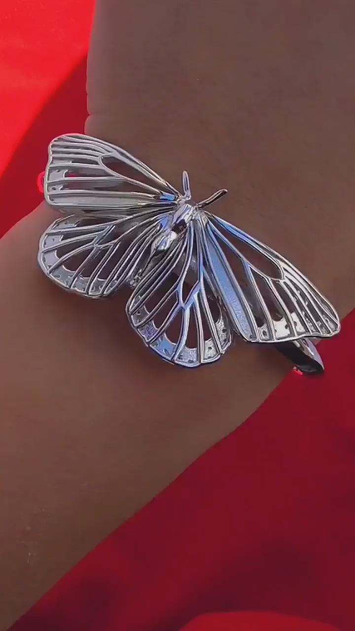 Video of silver Monarch Butterfly Bracelet on hand, highlighting movement, craftsmanship, and sculptural detail.
