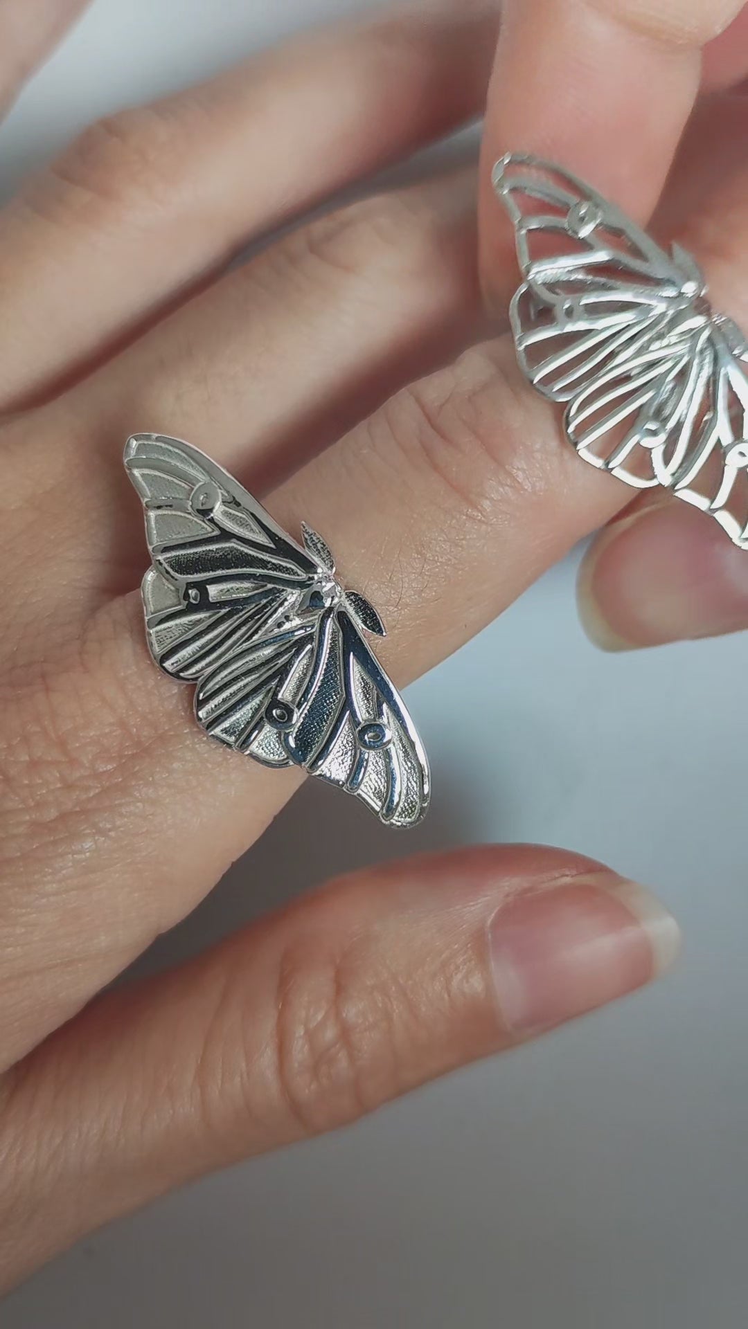 Nature-inspired ghostly silk moth bug ring in sterling silver, elegant insect jewelry piece