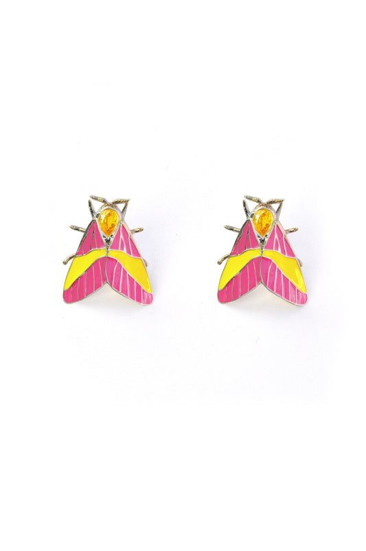 Rosy Maple Moth earrings in sterling silver with pink and yellow enamel wings, blue gemstone eyes, and yellow pear-shaped crystal on white background