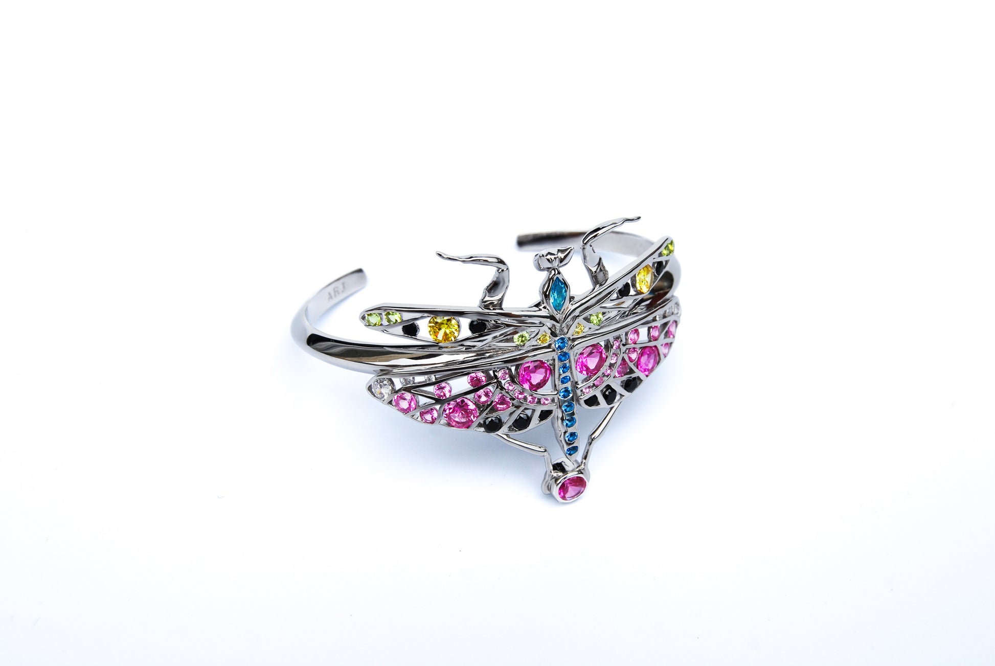 Top view of sterling silver praying mantis bracelet with enamel and zirconia details on white background