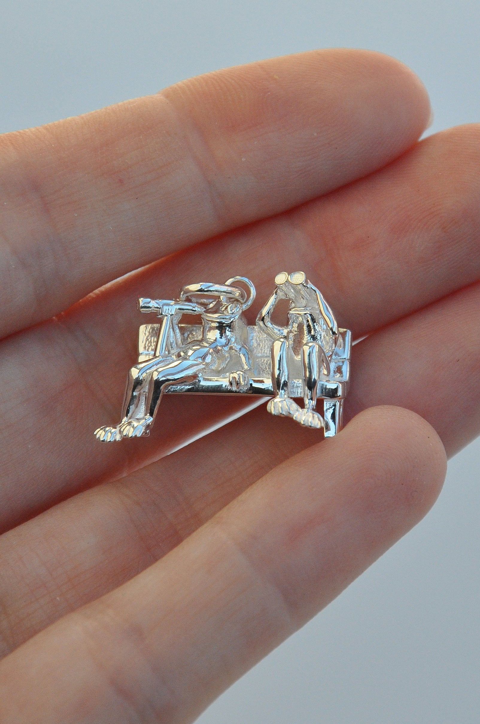 Stargazer Frogs Pendant showing two tiny frogs observing the sky, one with binoculars and one with a single‑lens viewer