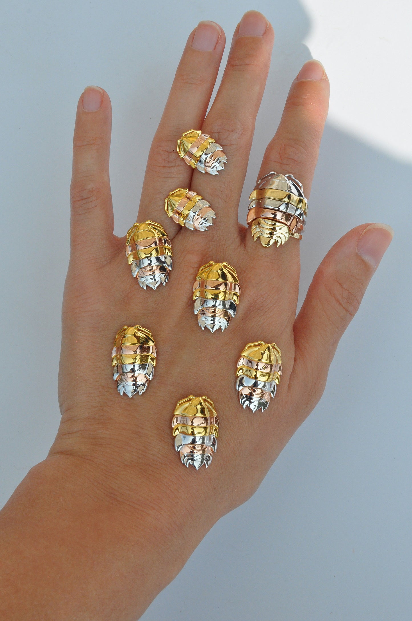 Sterling silver and 14k gold plated rainbow isopod ring inspired by colorful bugs