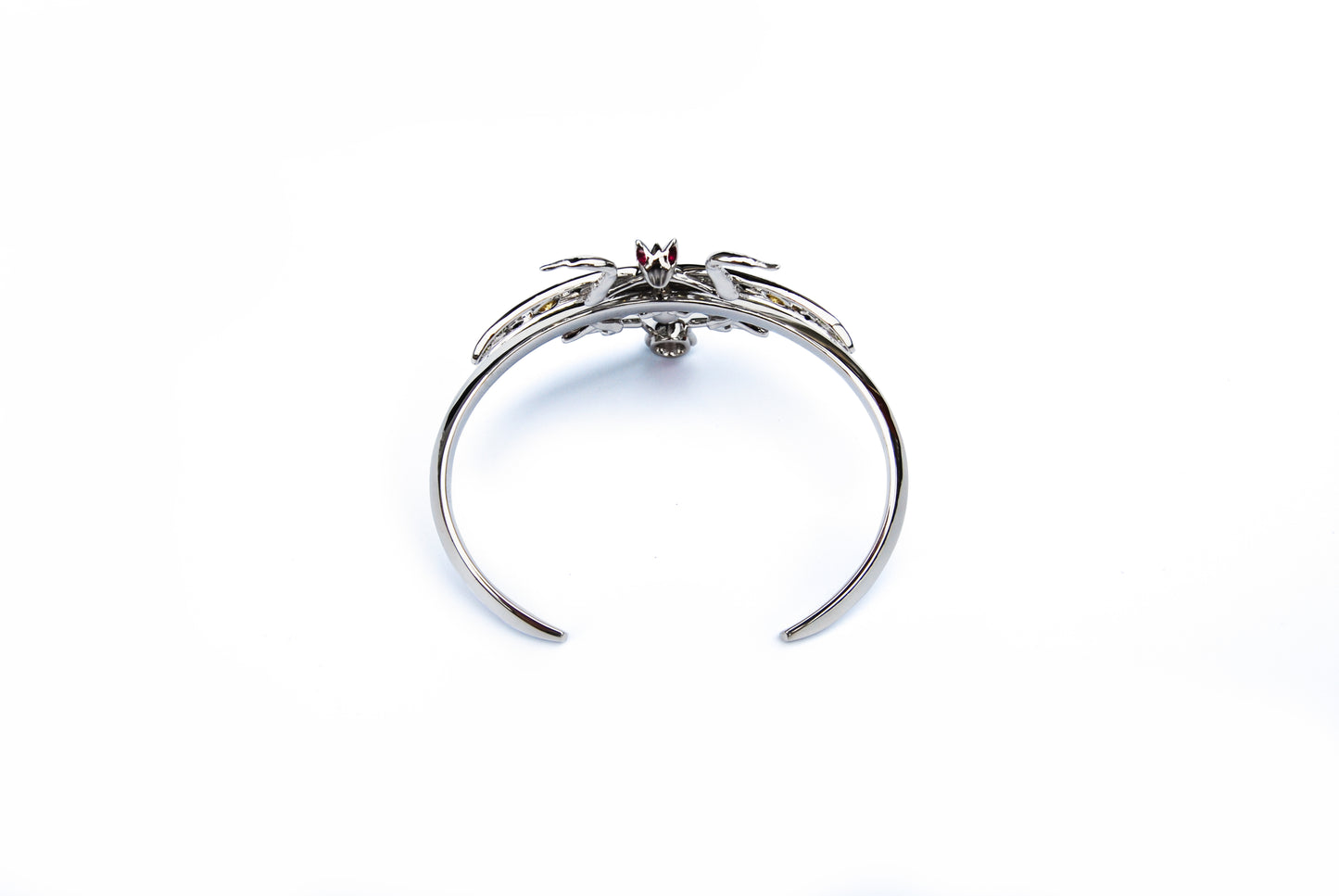 Top view of sterling silver Indian praying mantis bracelet with enamel and zirconia stones on white background