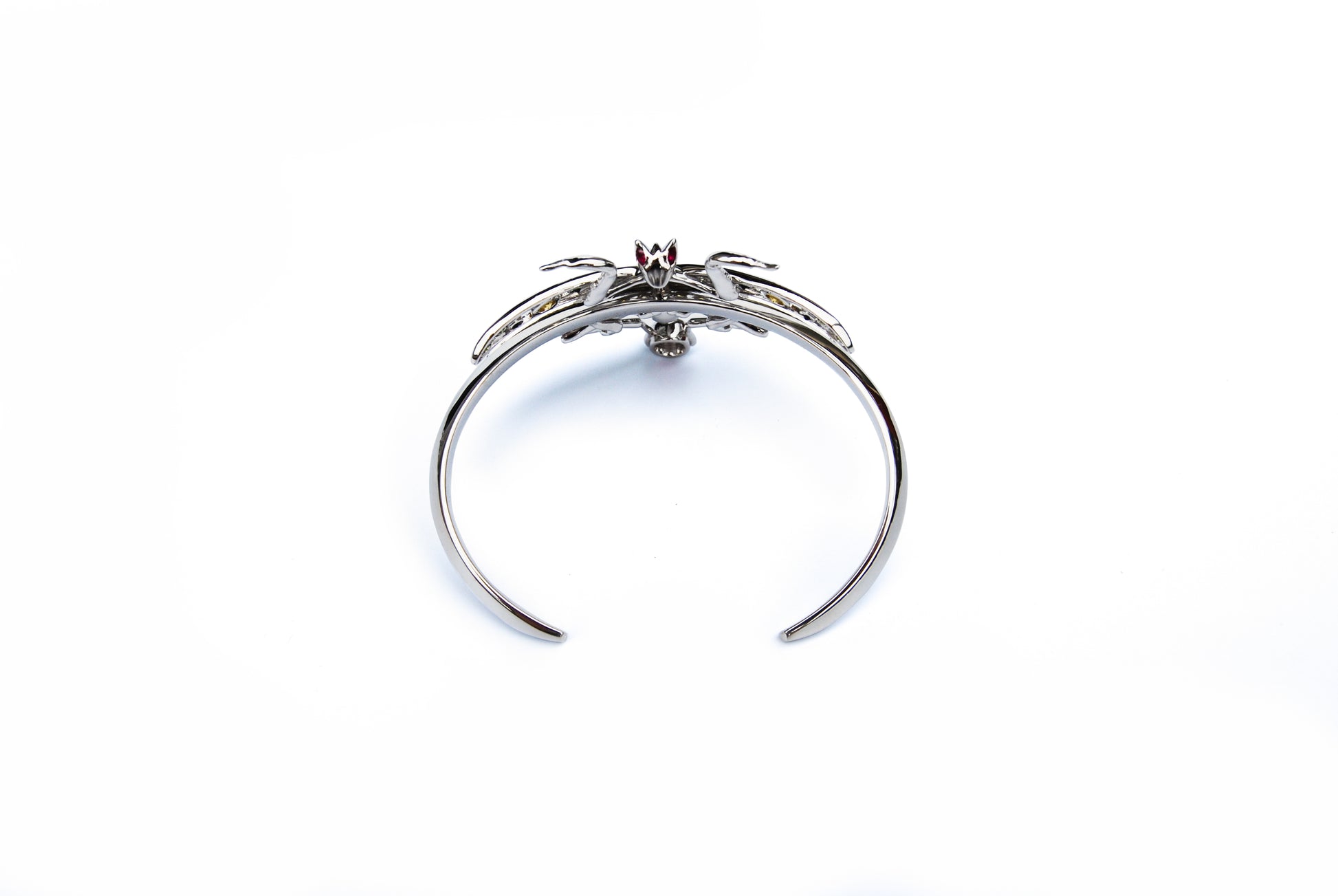 Top view of sterling silver Indian praying mantis bracelet with enamel and zirconia stones on white background