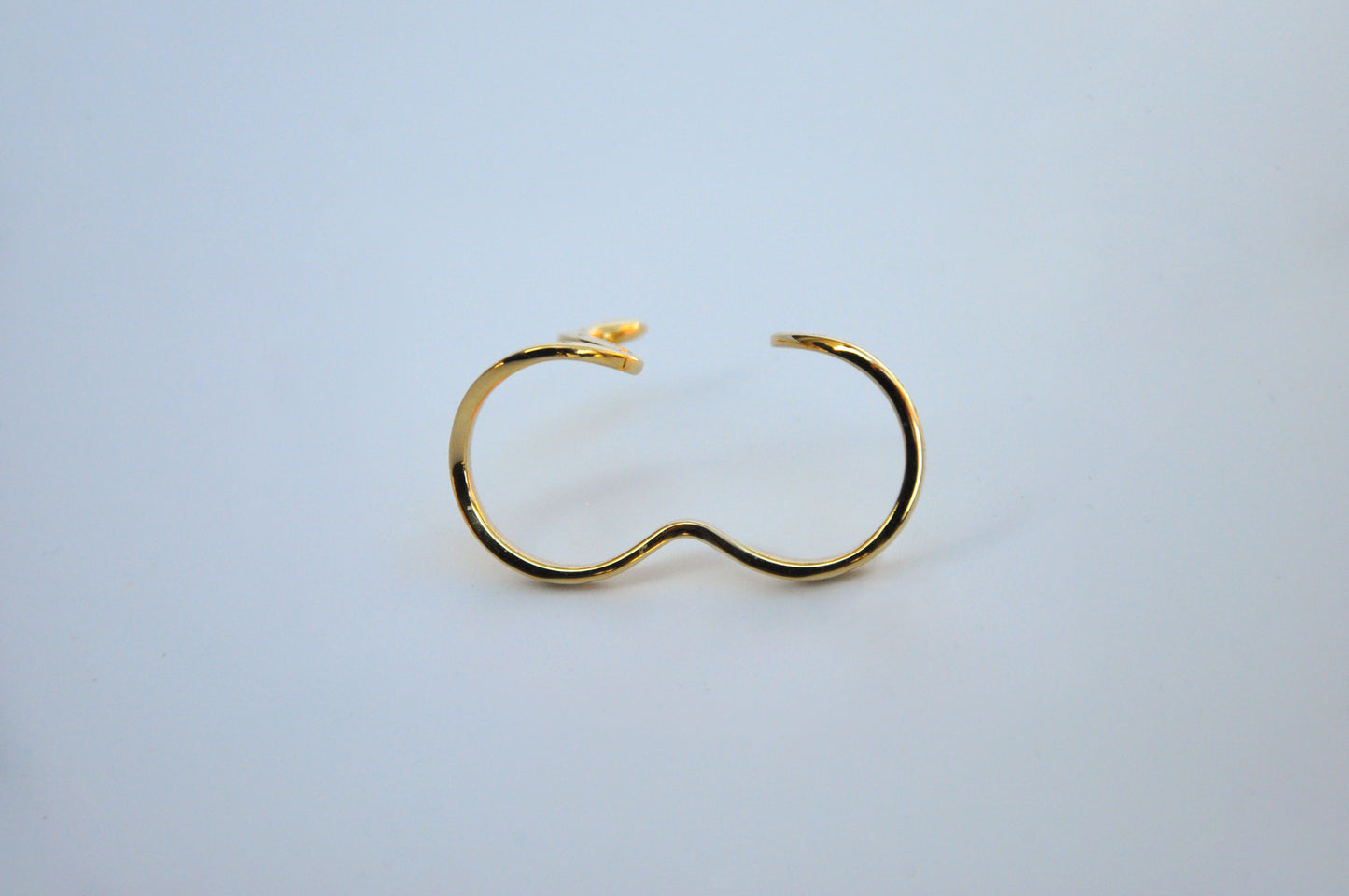 Two celestial snake rings side by side, front view on white background, showcasing design variations and celestial details.