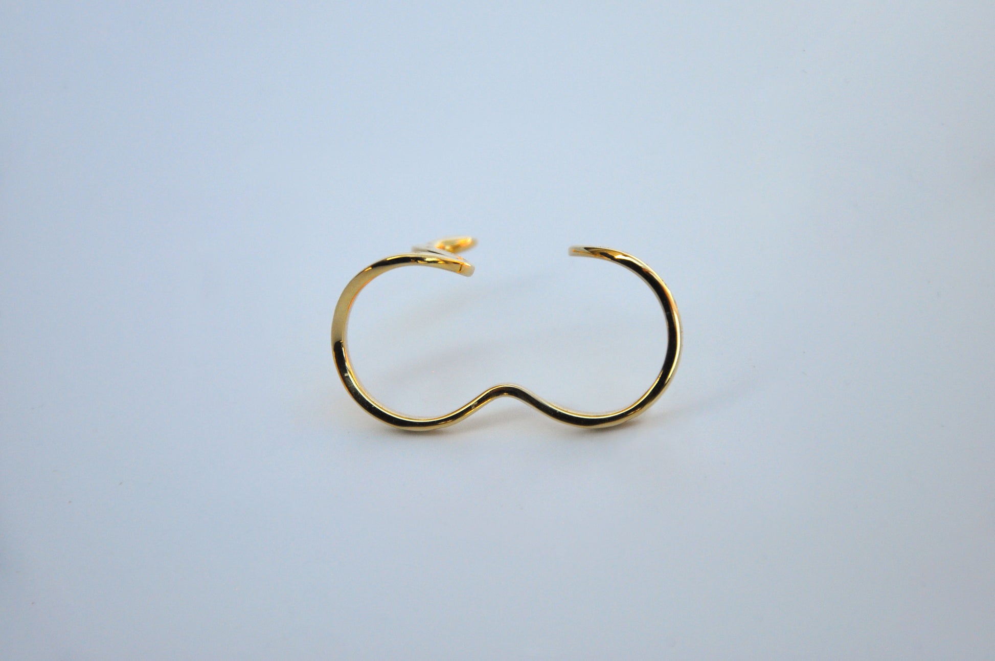 Two celestial snake rings side by side, front view on white background, showcasing design variations and celestial details.